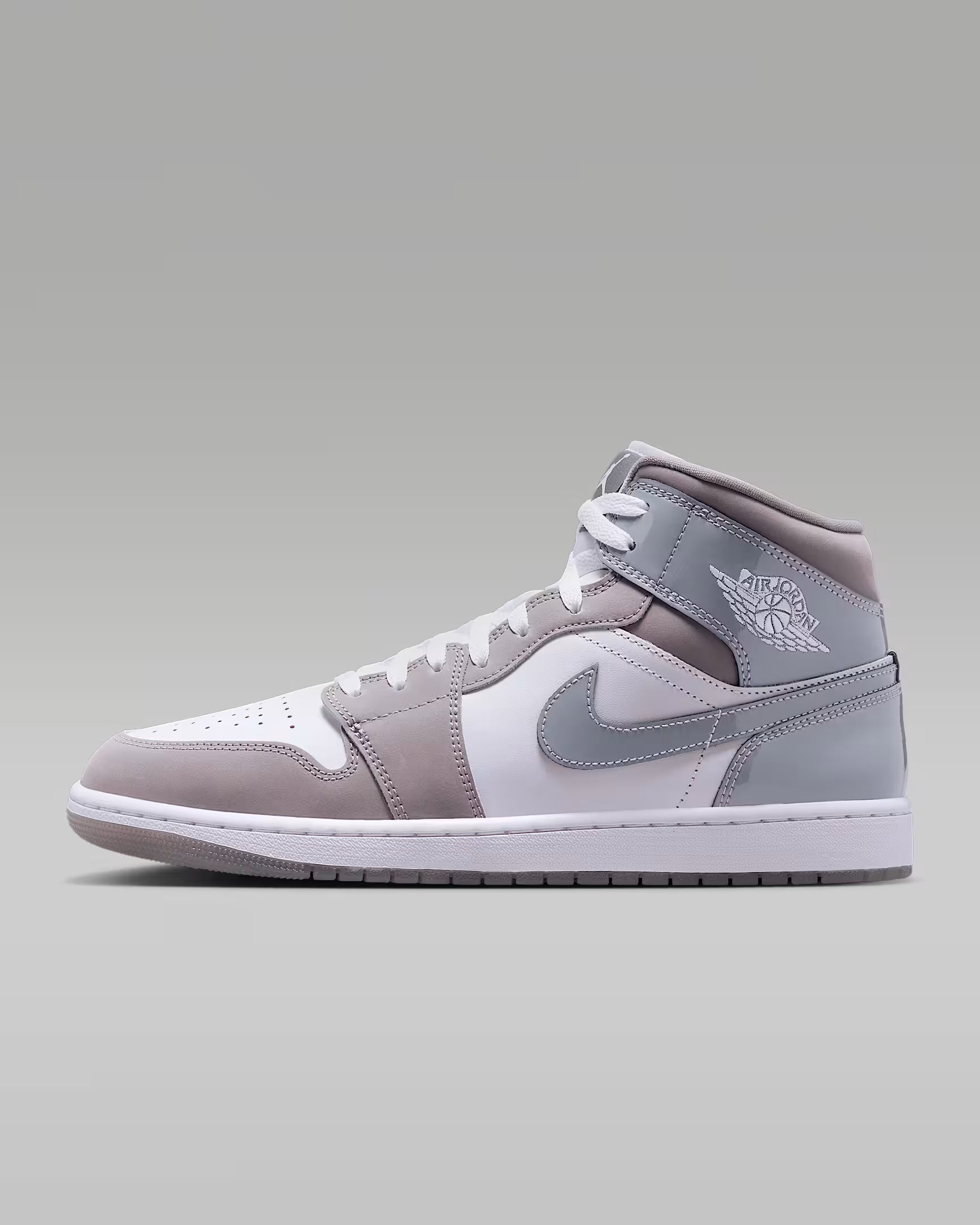 Air Jordan 1 Mid SE men’s sneakers in White, Cool Grey, and Medium Grey accents side view