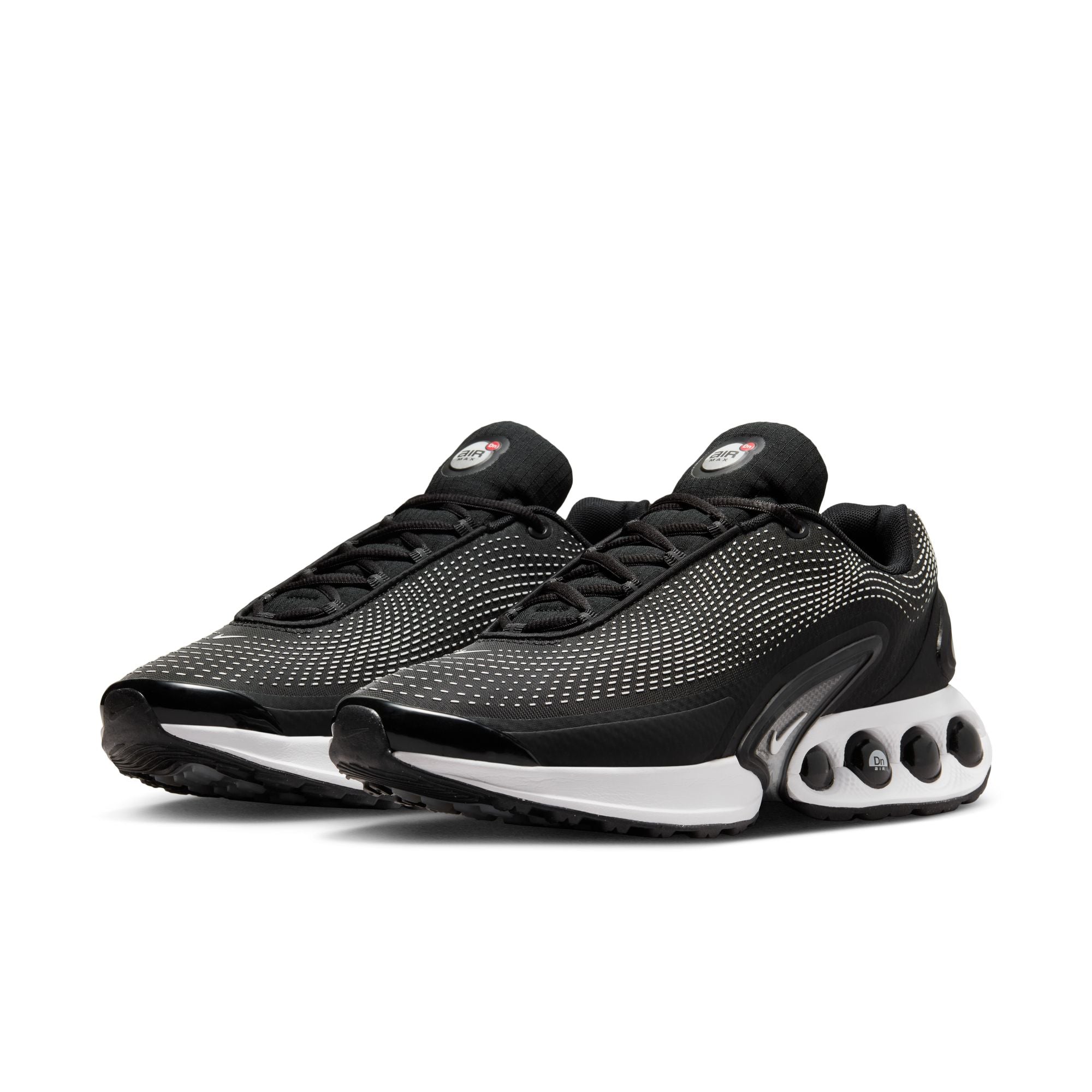 Nike Air Max DN in black with wolf grey accents and dynamic Air cushioning pods