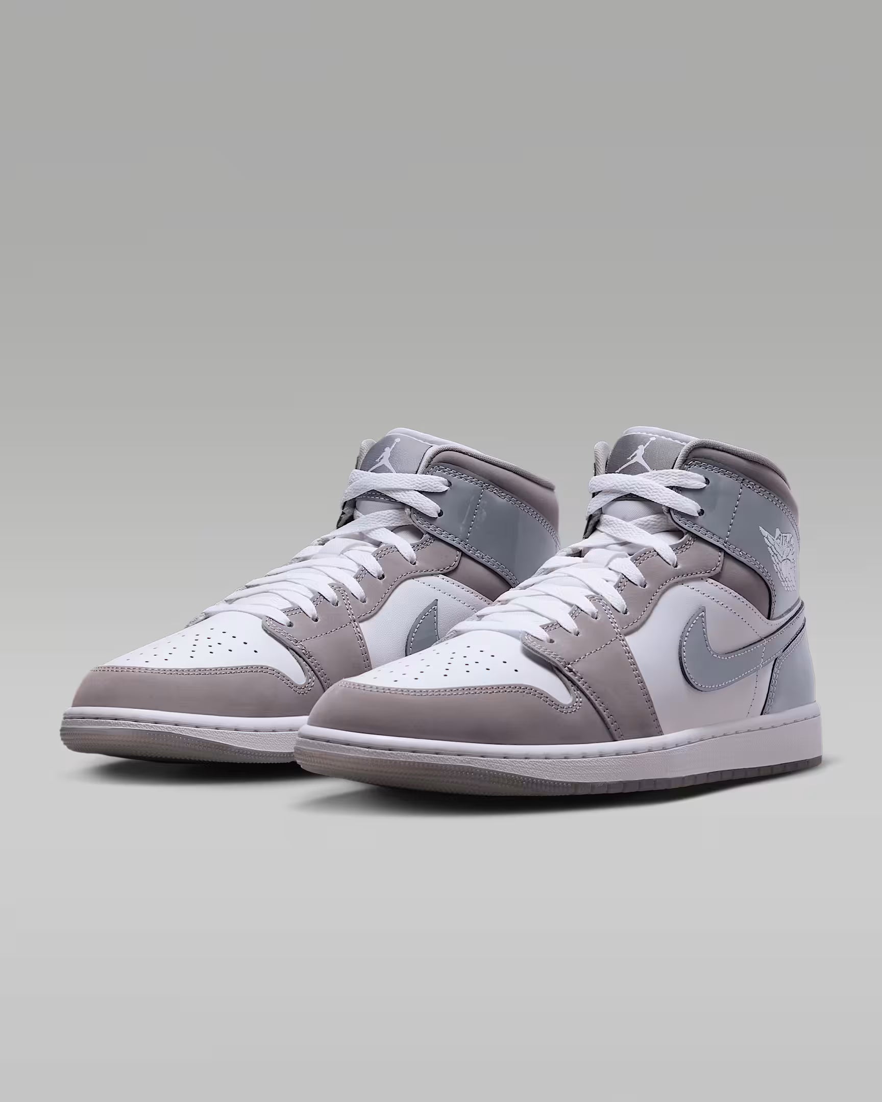 Air Jordan 1 Mid SE men’s sneakers in White, Cool Grey, and Medium Grey side view